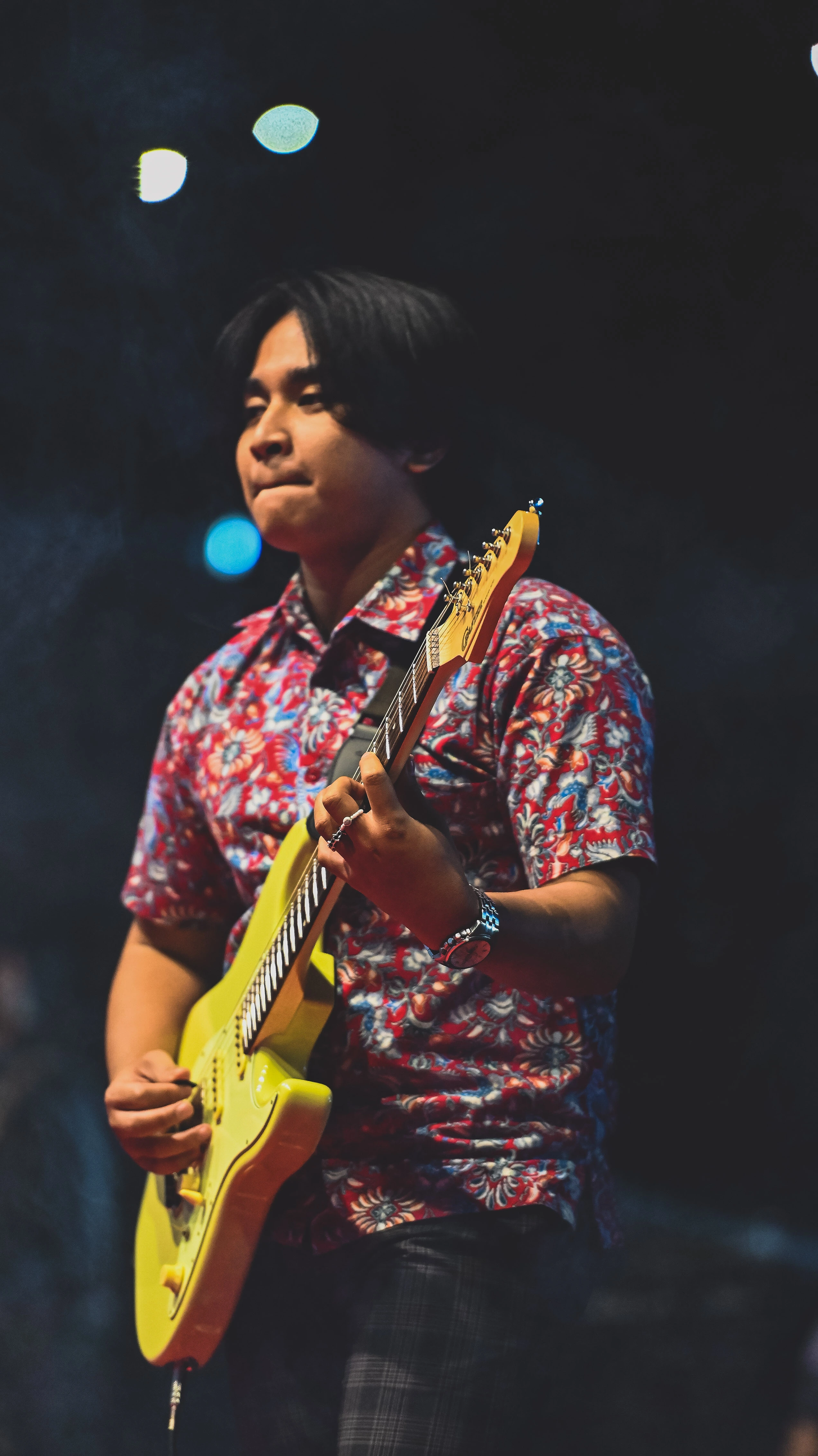 Nde Alfarezi playing acoustic guitar - Guitar instructor and content creator